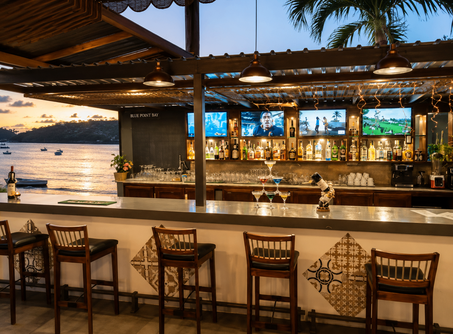 The bar at Point Bay Resort at sunset, looking out over the moored boats